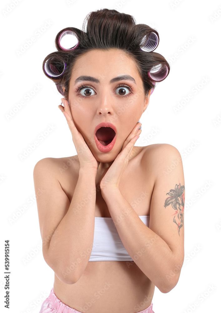 Funny surprised young woman with big head in hair curlers on white background Funny surprised young woman with big head in hair curlers on white background