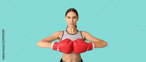 Sporty woman in boxing glov...