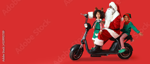 Cute little elves with Sant...