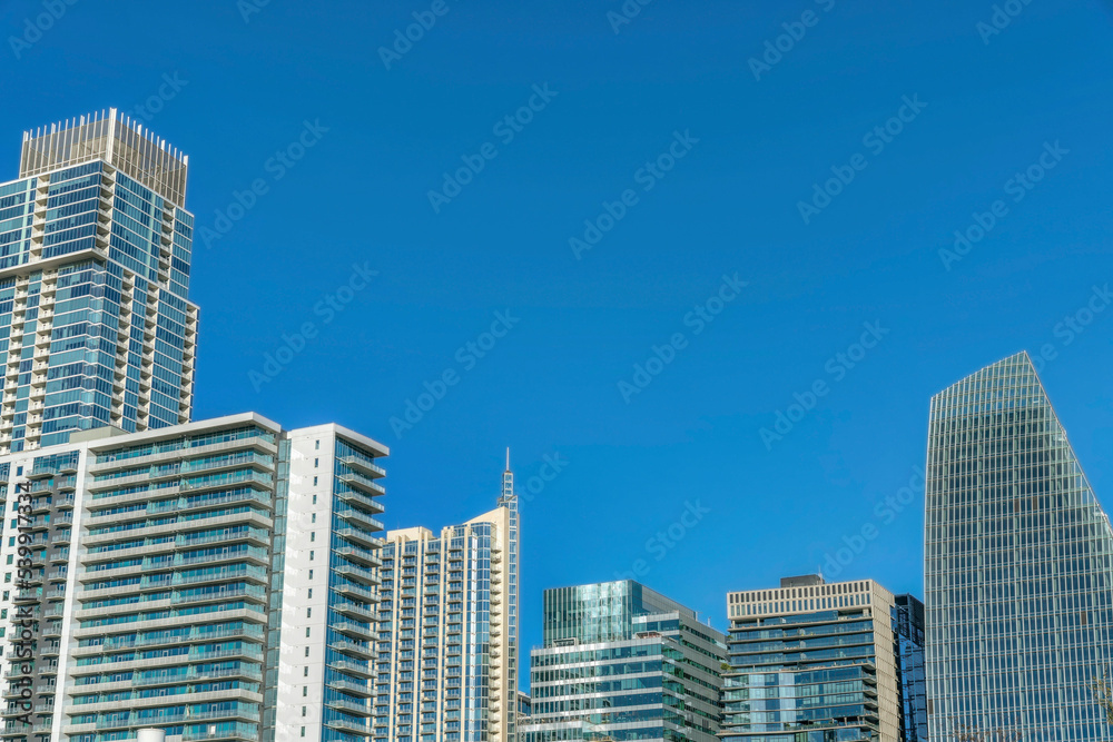 Austin Texas skyline with luxury apartments facade against blue sky background