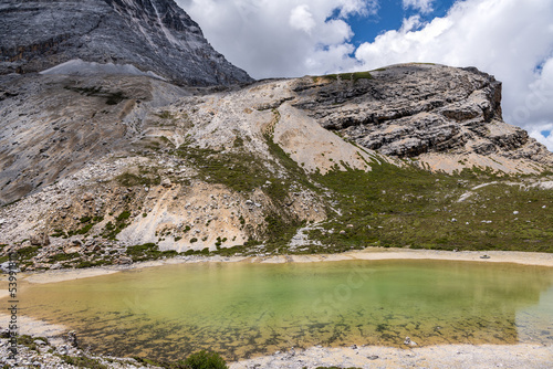 Colorful summer emerald lake and snow mountain at Yading nature reserve, The last Shangri la, Daocheng-Yading, Sichuan, China. photo