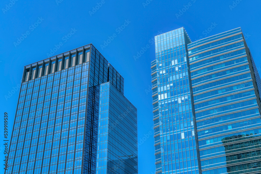 Skyline of Austin Texas with glass buildings and apartments against blue sky