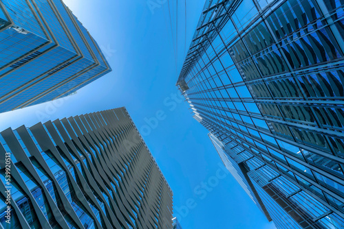 Modern apartments exterior and cloudless blue sky viewed from the bottom ground