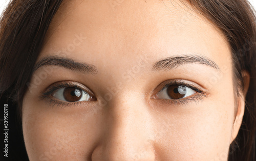 Young Asian woman with brow...