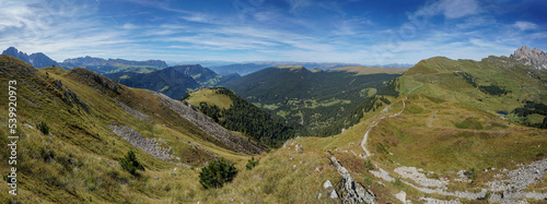 Stunning panoramic view in the dolomites: peaks at gardena valley, seceda and puez odles nature park.