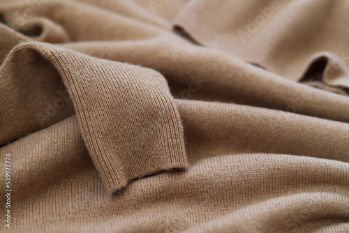 Knitted cashmere texture background. Warm sweater, pullover, jersey. photo