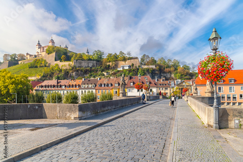 The hillside medieval Marienberg Fortress along the banks of the Main River in the historic Bavarian town of Wurzburg, Germany.	 photo