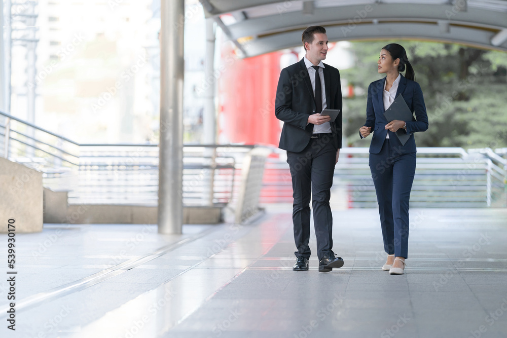 Business people walking and talk to each other Business people walking and talk to each other