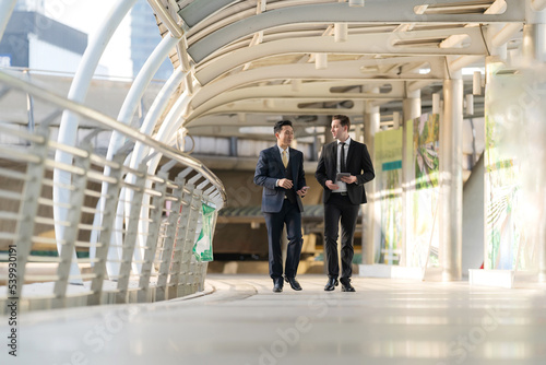 Business people walking and talk to each other