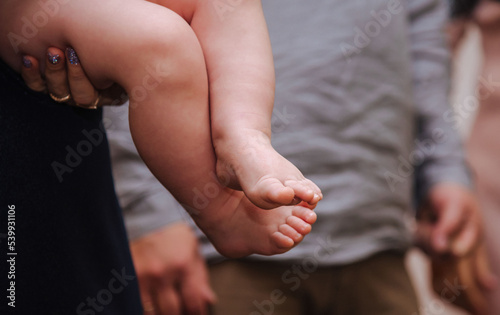arms and legs of the baby on the background of dreams