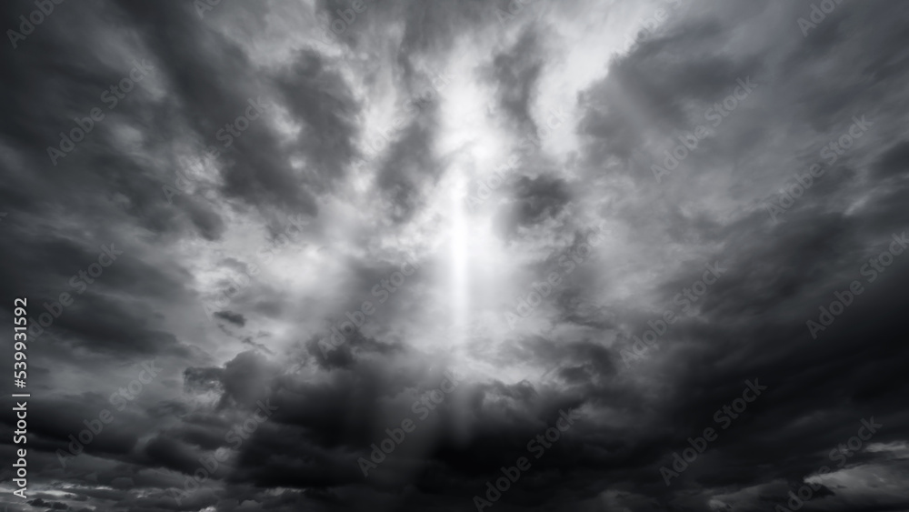 dark dramatic sky with black stormy clouds before rain or snow as abstract background, extreme weather, the sun shines through the clouds, high contrast photo dark dramatic sky with black stormy clouds before rain or snow as abstract background, extreme weather, the sun shines through the clouds, high contrast photo