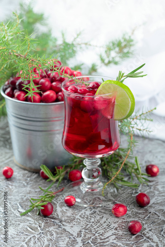 Tea with cranberries, lime, and rosemary.