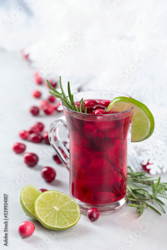 Tea with cranberries, lime, and rosemary.
