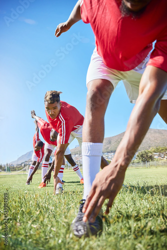 Soccer team, stretching and training for game, for practice and exercise for health, wellness or outdoor on field. Football, healthy players or focus to prepare on match day in sportswear for fitness