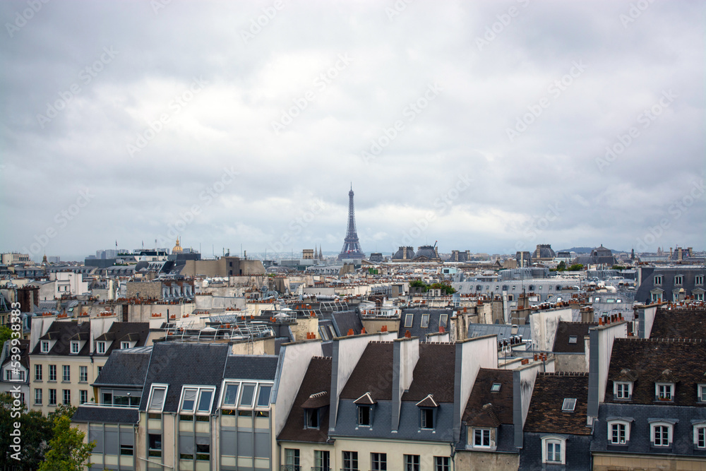 Paris cityscape with Eiffel Tower view on a cloudy day