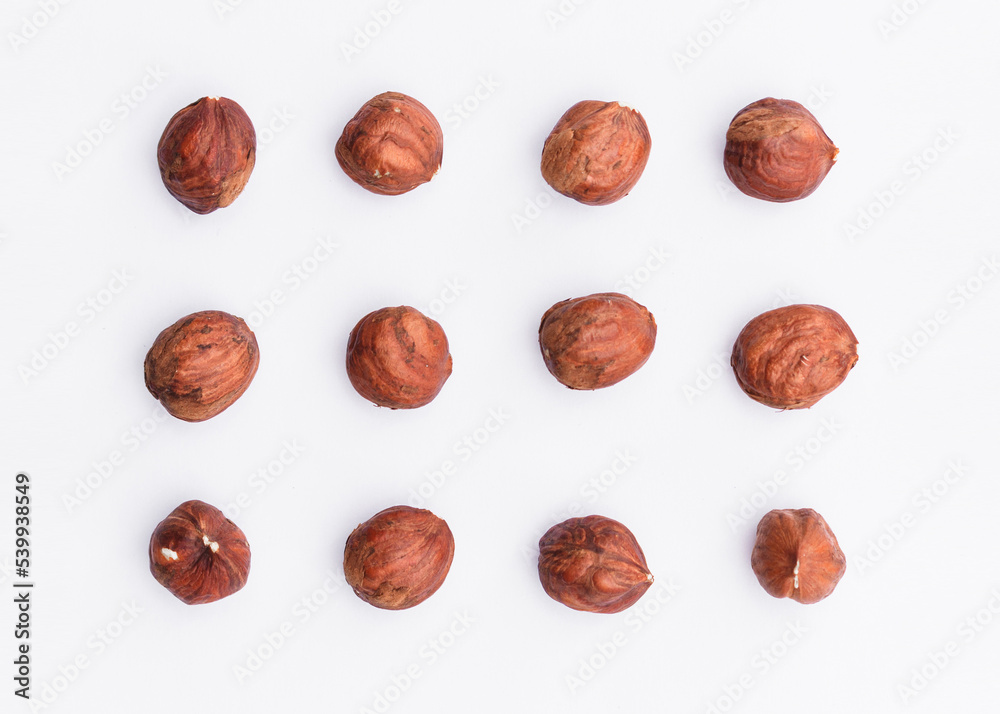 Hazelnuts isolated on white background. Composition of nuts pattern. Top view. Flatlay