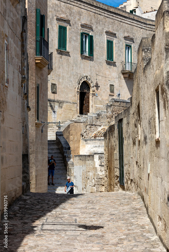  Cobblestone street in the Sassi di Matera a historic district in the city of Matera. Basilicata. Italy