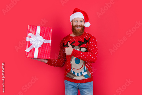 positive man with christmas present. merry christmas. santa man hold christmas present