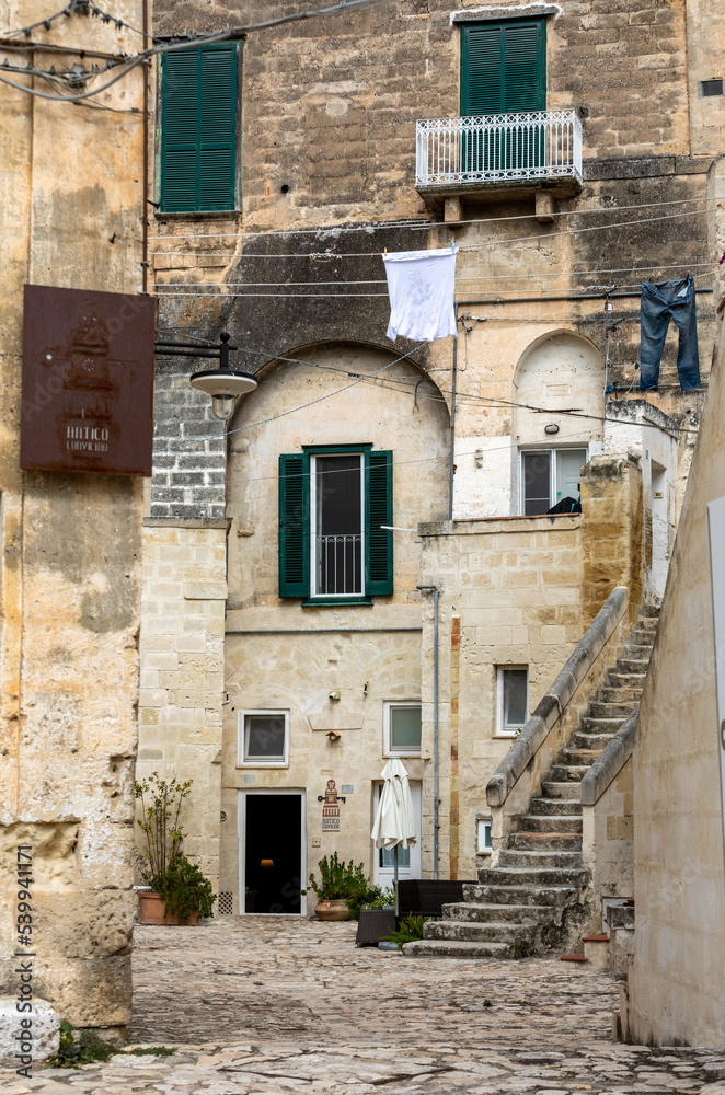 Matera, Italy - September 20, 2019: Houses in the Sassi di Matera a historic district in the city of Matera, well-known for their ancient cave dwellings. Basilicata. Italy