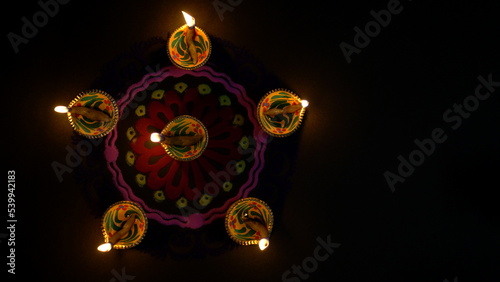 Colorful diya lamps lit during diwali celebration. Indian festival Happy Diwali, Holiday Background, Diwali celebration greeting card © Govind