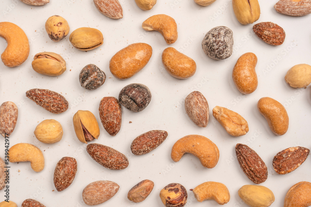 A group of almonds, pistachios, walnuts, macadamia, cashews. A group of almonds, pistachios, walnuts, macadamia, cashews.