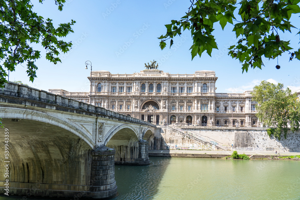 View over the river Tiber with the bridge Ponte Umberto I and in the background the city courthouse (Corte di cassazione) in Rome, Italy