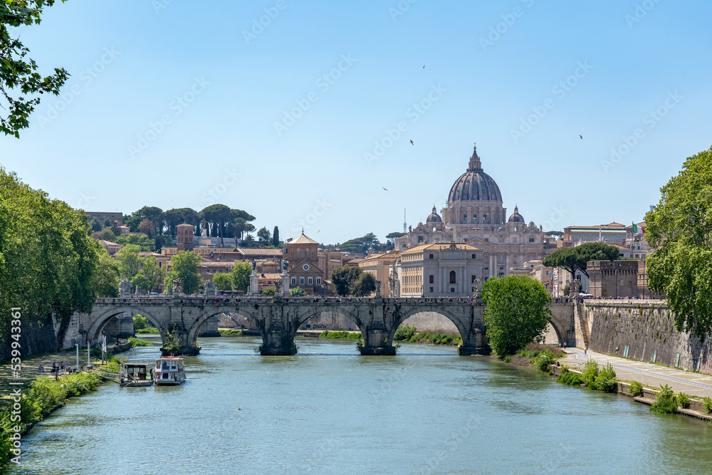 View from the bridge Ponte Umberto I over the river Tiber with in the background the Vatican City in Rome, Italy