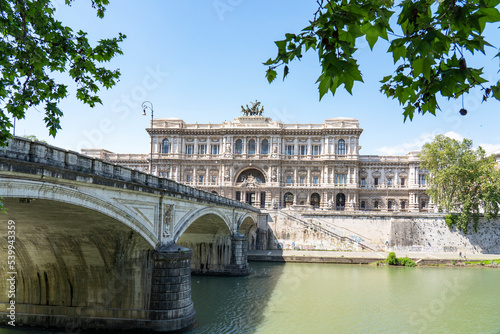 View over the river Tiber with the bridge Ponte Umberto I and in the background the city courthouse (Corte di cassazione) in Rome, Italy