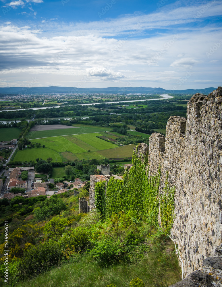 Obraz premium View on the medieval fortification of Rochemaure village, the countryside and the Rhone river valley in the South of France (Ardeche)