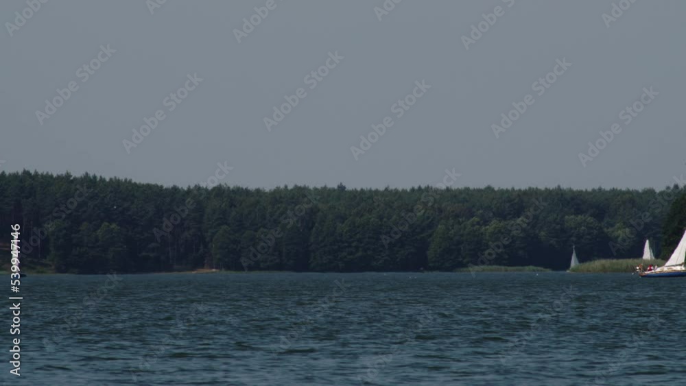 Boats sailing On Wdzydze Lake In Poland - wide, static Boats sailing On Wdzydze Lake In Poland - wide, static
