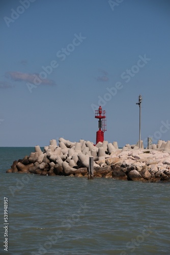 Italy, Marche, Pesaro: Red lighthouse in Fano.