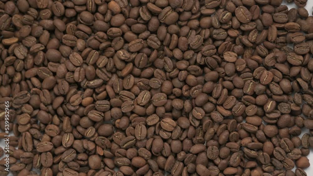 4k video of close up of coffee beans, coffee beans as texture, zooming in on the coffee.