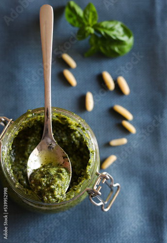 Pesto alla genovese fatto in casa isolato su sfondo grigio. Direttamente sopra. photo