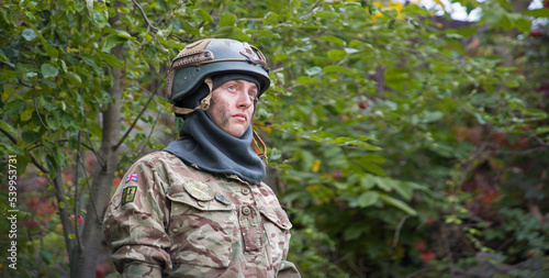 Sad woman soldier in uniform