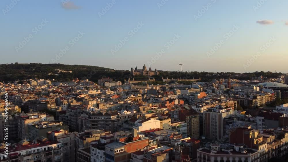 Barcelona majestic aerial drone view with Montjuic castle in distance, forward Barcelona majestic aerial drone view with Montjuic castle in distance, forward