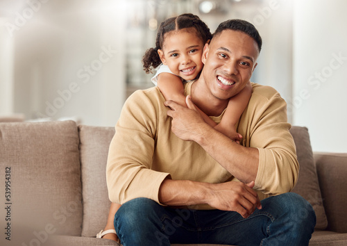 Happy, father and child hug on sofa for love, care and family bonding time relaxing in the living room at home. Portrait of kid hugging dad with smile for relationship happiness on the couch indoors