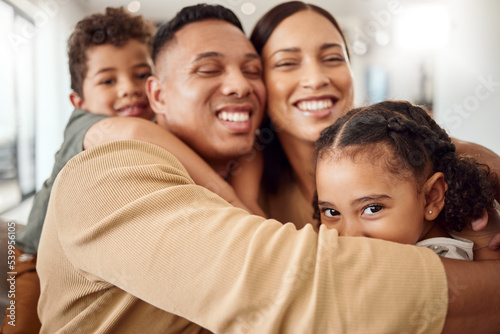 Fotografie Love, family and hug portrait in living room with Mexican parents and young kids in house