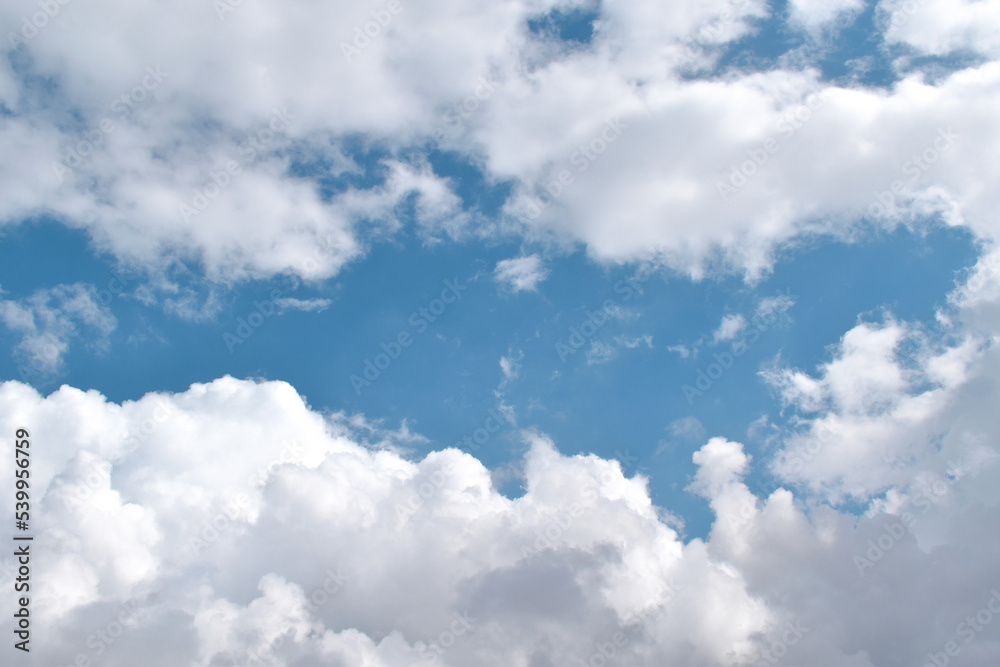 Fototapeta premium White clouds with blue sky in a sunny day. Sky in the morning. Concept of new life beginning, freedom of life and peaceful. 