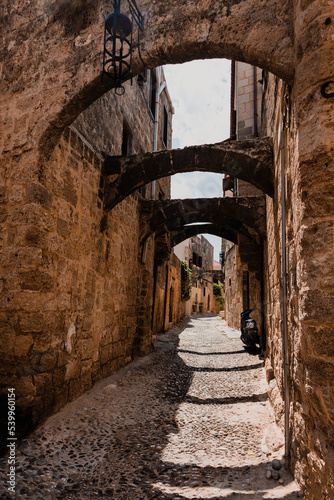 Narrow cobbled historical streets in Old Town of Rhodes  Dodecanese  Greece. High quality photo