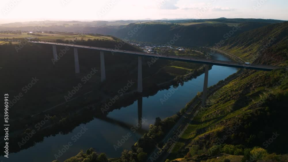 Romantic aerial drone flyover the Moseltalbrücke and highway A61 over moselle valley, bridge connecting the Eifel mountains - Moselle Viaduct, Winningen, Germany establishing shot 2022
