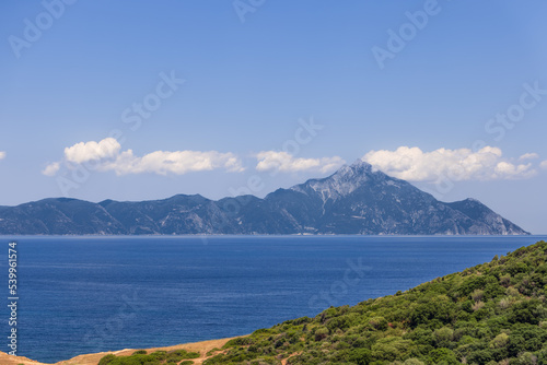 Slhouette of Mount Athos and the peninsula of the same name protruded into the Aegean Sea. Chalkidiki, Greece. © Artem