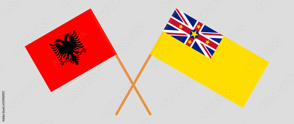 Crossed flags of Albania and Niue. Official colors. Correct proportion Crossed flags of Albania and Niue. Official colors. Correct proportion
