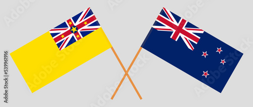 Crossed flags of Niue and New Zealand. Official colors. Correct proportion