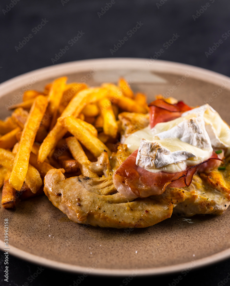 typical czech cuisine chicken slice baked with ham and camembert with french fries typical czech cuisine chicken slice baked with ham and camembert with french fries