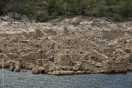 Abandoned old village of Vilarinho da Furna, Portugal. Submerged since 1971 because of the dam construction, emerged due to the current drought in this region - September 2022 photo