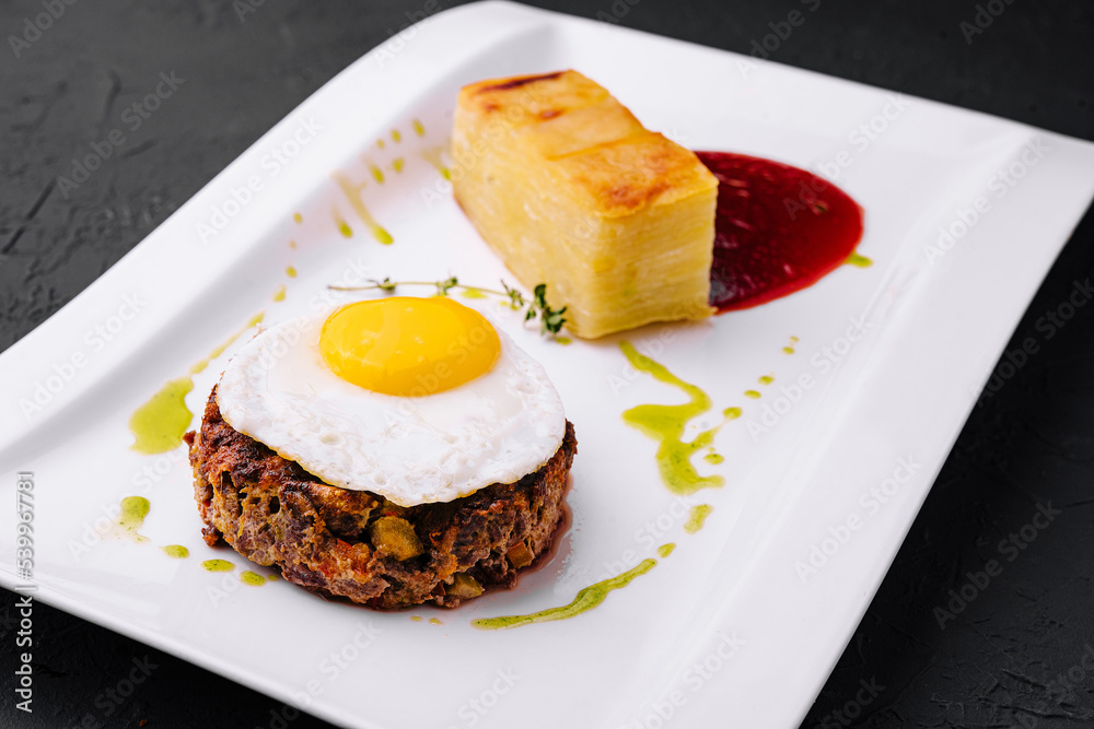 fried vegetable tartare with egg on plate fried vegetable tartare with egg on plate