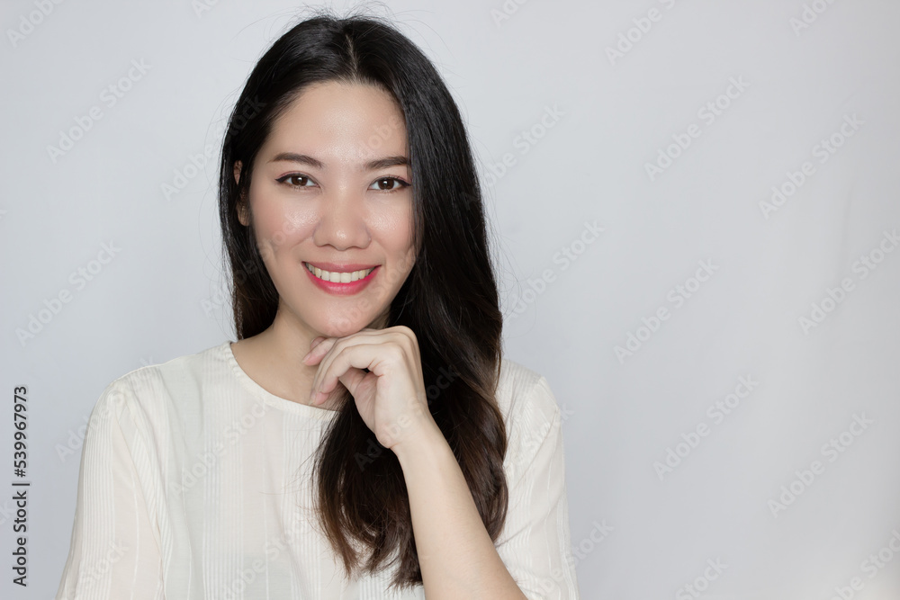 Asian beautiful woman rise chin on hand with confidence, smile and happiness. Asian beautiful woman rise chin on hand with confidence, smile and happiness.