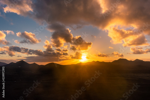 Beautiful sunset over the Volcanos National Park in Lanzarote, Canary Islands,  Spain