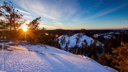 Sunset time-lapse over snow covered hills, Upper Peninsula of Michigan 4K photo