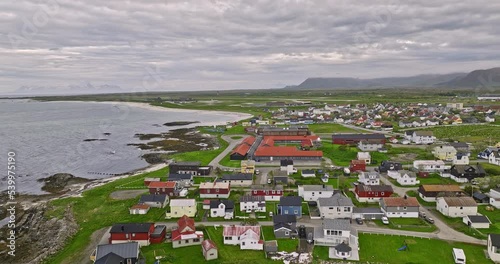 Andenes Norway v2 cinematic low level flyover coastal village town center capturing andøya airport, residential neighborhood and local schools on an idyllic day - Shot with Mavic 3 Cine - June 2022 photo